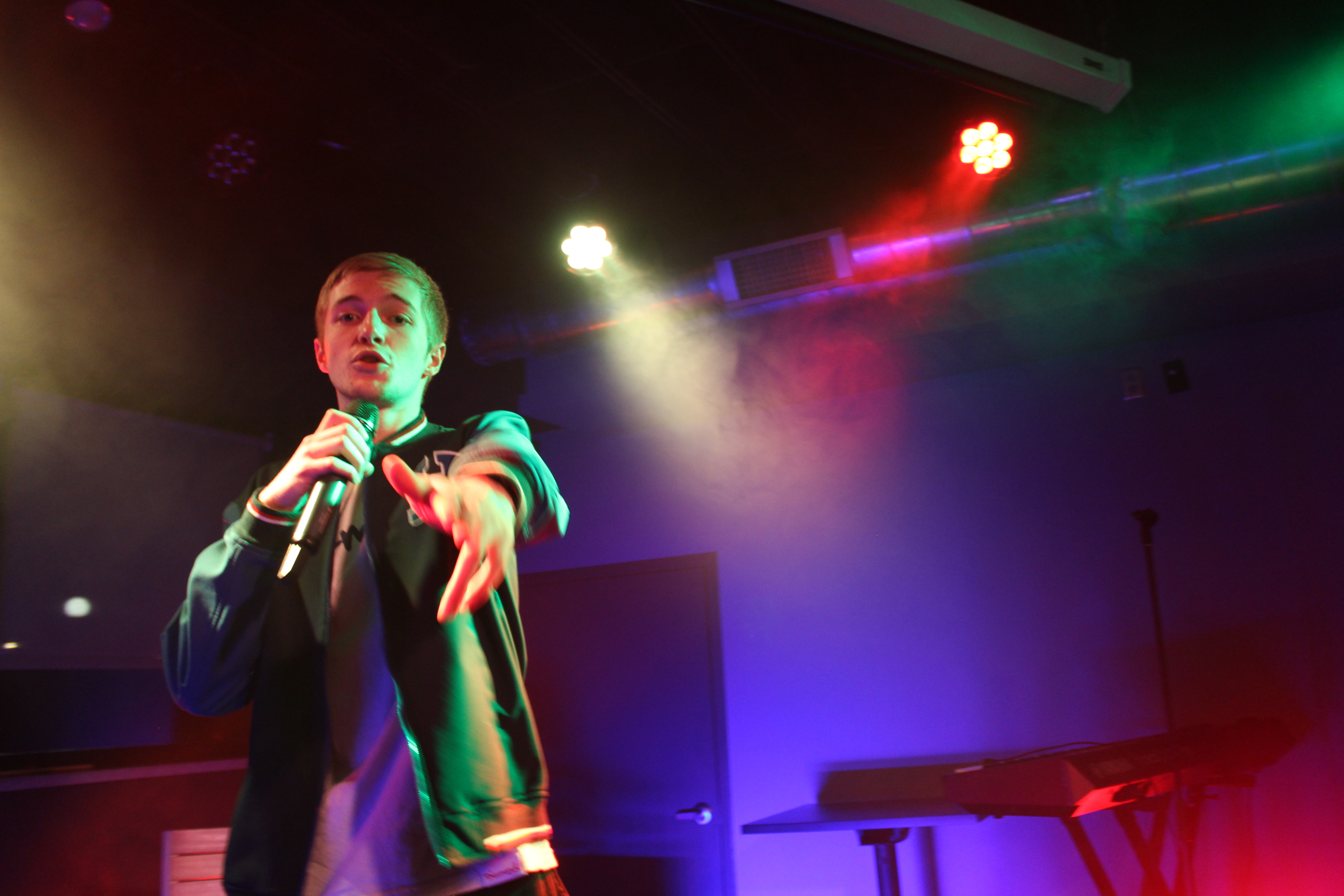 Performing live on stage with microphone